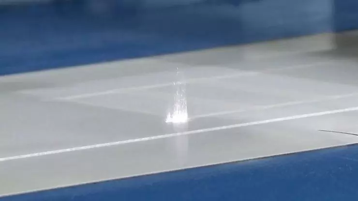 Laser cutting adhesive label on rotary machine